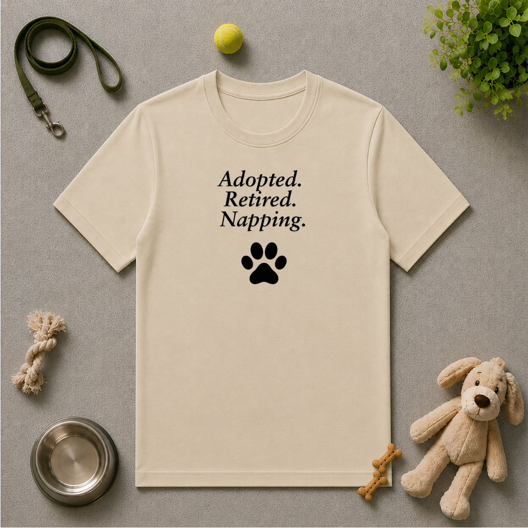 Paw Prints on Our Hearts – Adopted. Retired. Napping. - Unisex T-Shirt